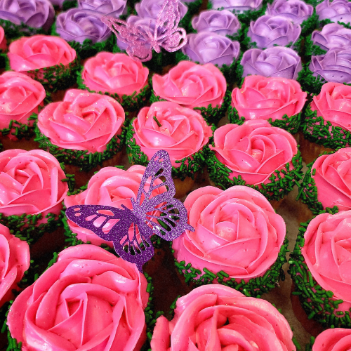 Rose frosted cupcakes with purple butterflies pink and lavender Sugar Dreams Bakery Patchogue